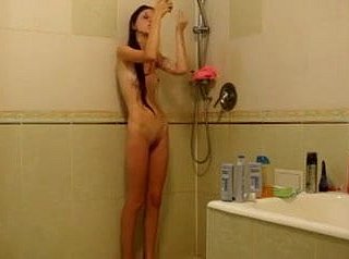 Shrivelled girl under the shower